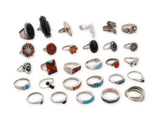 236
A group of Southwest-style silver and stone set rings
Mid/late 20th century
Six variously marked for maker including: R. Dishta [for Robert Dista, Zuni] / JD / L / JoAnn Yazzie
TK [stylized with double feather, for Ray Tracey (Navajo/Diné)/Knifewing Segura] / RQ; seven marked for sterling
A mixed group of rings featuring various stones including turquoise, coral, spiny oyster, onyx, mother of pearl, and malachite, in various styles including bezel-set, cluster-set, mosaic inlay, and silver overlay
29 pieces
Ring sizes: 10 to 4
104.7 grams gross
Estimate: $200 - $400