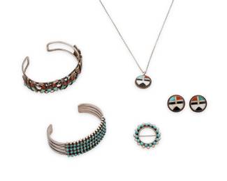 272
A group of Zuni Pueblo style sterling silver and set stone jewelry
Mid/late 20th century
Each unmarked
Five works comprising a four-wire cuff bracelet with row set petit point turquoise, a two-wire cuff with row-set butterfly motifs with turquoise and coral stone inlay, and a diminutive cluster set turquoise round brooch, as well as a small round stone inlay Sunface pendant and a pair of matching earrings
6 pieces
Cuffs: 6.125" total inner C x 0.75" H & 7" total inner C x 0.75" H; brooch: 1" Dia.; Sunface set: each 0.75" Dia.; chain: 18" L
61.7 grams gross
Estimate: $400 - $600