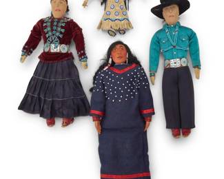 248
A group of Native American dolls
20th century; Navajo dolls circa 1954
Four dolls comprising a small Plains hide doll with beadwork hide dress, yarn hair and painted features (7" H x 5.5" W, with arms), a large Plains fabric doll with sculpted painted clay head and hands, black hair, blue trade cloth dress with white beads and with white leather beaded moccasins (14.5" H x 5.5" W), and a Navajo/Diné doll couple, the woman with traditional velvet blouse and gathered skirt, with beadwork jewelry and concho belt, and the man with beaded jewelry, concho belt, and black felt hat, each with traditional Navajo 'tsiiyéél' hairstyle in thread, as well as embroidered features, and leather footwear (12" & 11" H)
4 pieces
Estimate: $300 - $500