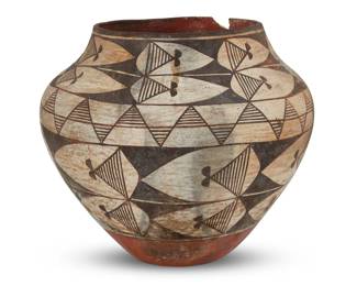 93
An Acoma Pueblo polychrome pottery olla
19th century
The three-color jar with brown banded geometric motifs above a terra cotta wash and puki indentation
8.25" H x 9.25" Dia., irregular
Estimate: $400 - $600