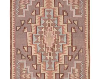 47
A Navajo Burntwater raised outline textile
Late 20th century, Diné, Mary Ann Nez
Woven in pale multicolor wool, with central concentric stepped and serrated diamond within a sawtooth border
56.5" H x 38" W
Estimate: $500 - $700