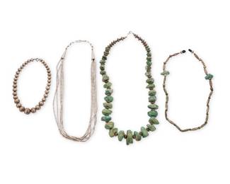 215
A group of Southwest style sterling silver and turquoise jewelry
Mid/late 20th century
Unmarked
Three necklaces including a chunky graduated turquoise nugget necklace with ridged silver bead spacers (29" L), a five-strand chunky liquid silver necklace with cone clasps (26" L), a graduated stamped silver bead choker necklace (15" L), and a spectacle retainer/ eyeglasses chain of silver beads and turquoise tabs (23" L)
4 pieces
387.7 grams gross
Estimate: $700 - $900