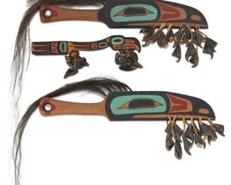 134
Three Northwest Coast polychrome carved cedar raven rattles
Mid/late 20th century
Each unmarked
Each mounted with deer hooves, comprising a near-pair additionally mounted with horse hair and abalone shell accents to handles, and a smaller rattle
3 pieces
Each larger wood only: 20.75" H x 3.5" W x 0.75" D; With hooves: 9.5" W approx.; Smaller overall: 13.25" L x 5" W x 1.25" D
Estimate: $300 - $500
