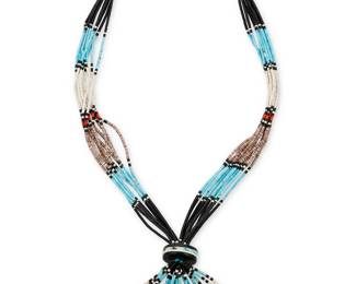 118
A Kewa/Santa Domingo Pueblo multistrand heishi necklace
Mid/late 20th century, Kewa
Unmarked: possibly by Paul Tenorio / Kewa/Santo Domingo
A ten-strand necklace with heishi, turquoise, coral, jet, and clam beads, with large central disc bead finished with looped strands, and with traditional cord neck wrap
26" L x 3.25" H
54.2 grams gross
Estimate: $600 - $800