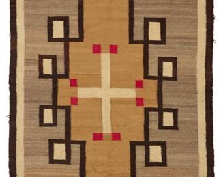 7
A Navajo regional rug
Early 20th century, Diné
Woven in red, cream, grey, dark brown, and tan wool with a central Spider Woman cross within a stepped diamond, floating crosses to each corner, and a banded border
73" H x 43" W
Estimate: $600 - $800