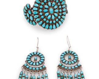 184
A set of Zuni Pueblo style sterling silver and cluster set turquoise jewelry
Mid-20th century
Each unmarked
Comprising a three-wire silver and cluster set turquoise cuff bracelet and a similar design pair of cluster set articulated dangle earrings
3 pieces
Cuff: 6.25" total inner C x 2.25" W, with a 1.25" gap; Earrings: 3.5" H
67.0 grams gross
Estimate: $600 - $800