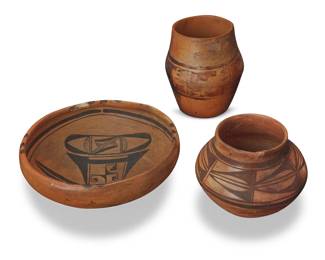 103
Three Hopi Pueblo pottery jars
Early 20th century
Comprising a bowl with red and brown katsina decoration to interior, an olla jar with geometric banding to shoulder, and a tall jar with red and brown kiva step and zigzag motifs to body, each on a cream slip ground
3 pieces
Bowl: 3.625" H x 9" Dia.; Olla: 4.5" H x 5.75" Dia.; Jar: 5.75" H x 4.875" Dia.
Estimate: $500 - $700