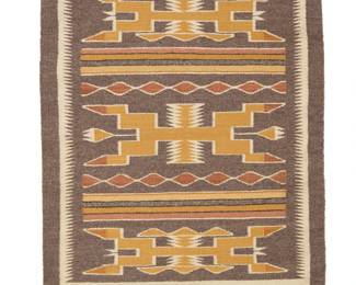 44
A Navajo Teec Nos Pos textile
Late 20th century, Diné, Betty Tsosie
Woven in natural grey, cream, ochre, and brown wool, with animal figures and stacked diamonds
31.75" H x 23.75" W
Estimate: $300 - $500