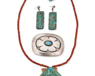 221
A group of Southwest style jewelry
Mid-20th century or earlier
Four works comprising a shell pendant necklace with turquoise chip mosaic inlay and pipestone beads (20" L x 2" H), a pair of inlaid turquoise and wood tab earrings (2.5" H), a sterling silver and turquoise inlay ring (size: 10.75), and a sterling silver and set turquoise belt buckle (2.25" H x 3" W)
5 pieces
101.4 grams gross
Estimate: $400 - $600