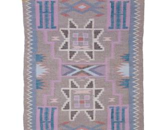 51
A Navajo raised outline Storm Pattern textile
Late 20th century, Diné, Priscilla Nez
Woven in pale multicolor, grey, and brown wool, with a storm pattern and waterbug motifs within a serrated border
43.5" H x 32.5" W
Estimate: $500 - $700