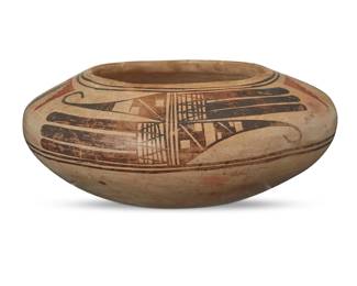 98
A Hopi Pueblo polychrome pottery bowl
Early 20th century
The three-color low bowl with red and brown avian and kiva step motifs to shoulder on a cream slip ground
2.875" H x 6.875" Dia.
Estimate: $500 - $700
