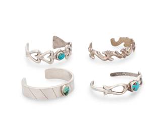 201
A group of Southwest style sterling silver cast silver cuff bracelets
Mid/late 20th century
One stamped: G.M.K. / Sterling
Comprising three narrow openwork cast silver cuffs with ornate curvilinear motifs, two with set turquoise, as well as a chunky narrow cuff with set turquoise and incised line accents
4 pieces
Each: 6" total inner C; 0.75 to 0.5" H
105.8 grams gross
Estimate: $300 - $500