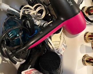 Hair dryers, curling irons and flat irons