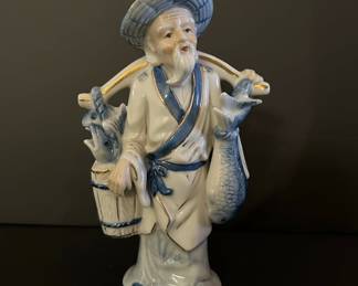 Vintage Blue and White Porcelain Fisherman Figurine with Gold Accents