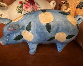 Blue Ceramic Pig Figurine with Yellow Spots and Green Leaf Accents