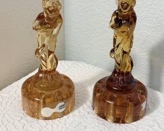 Lot #58 Art Deco “Bashful Charlotte” Amber Glass Flower Frog Pair – Coordinating Yet Different Figural Design apx 6" Tall