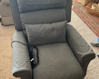 Grey Recliner with mechanical life to stand. 42"H, 33"W, 44"D, full recline 68", cushions do not detach, back comes off for transport