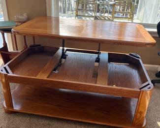 Coffee Table extends up. 18"H, 26"H when lifted, 50"W, 30"D