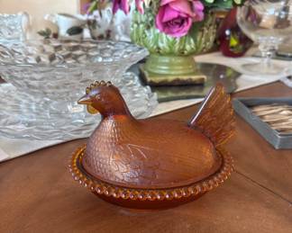 Amber glass hen on nest