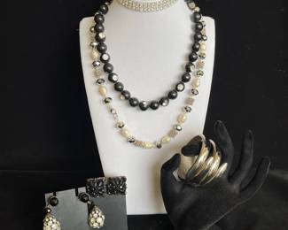 2 Necklaces * 1 Hinged Silver Bracelet * 1 Stretch Costume Rhinestone * 2 Clip Earrings * 1 Pendant
