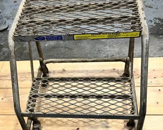 Industrial two step on castors.