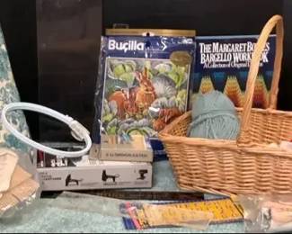 Mixed Craft Needlework Supplies with Patterns, Yarn, and Basket