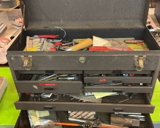 Multi drawer craftsman toolbox with contents.