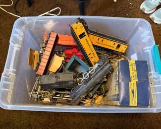 Assorted group: American Flyer 293 Locomotive, tender and other freight cars, tracks, etc., along with Frontiersman passenger cars and boxes