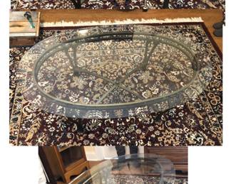 *PRE-SALE ITEM - Oval Glass and Metal Coffee Table is 47.5 inches Long x 28 inches Wide x 17.5 inches Tall. $65.  Located in a Walkout Basement.