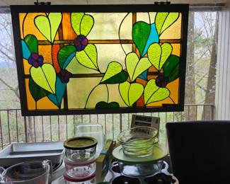 Stained glass by local artists, windows came from their home.