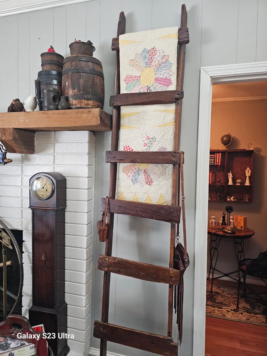 Quilt ladder and very unique clock with wooden barrels