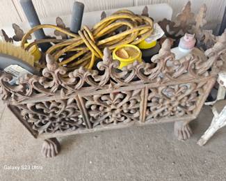 cast iron planter or firewood holder 