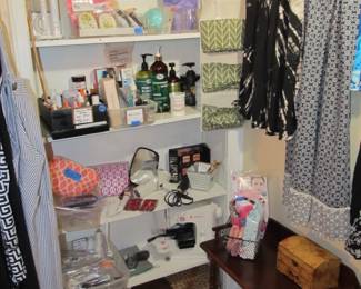 Ladies' boutique with blouses, tops, dresses, pants, casual items, jeans, designer purses, belts, shoes, hats, and more. We also have an incredible selection of cosmetics and more—as well as sewing items and a Singer Sewing Machine.