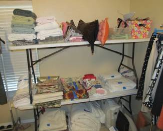 Ladies' boutique with blouses, tops, dresses, pants, casual items, jeans, designer purses, belts, shoes, hats, and more. We also have an incredible selection of cosmetics and more—as well as sewing items and a Singer Sewing Machine.