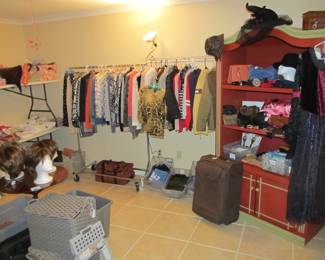 Ladies' boutique with blouses, tops, dresses, pants, casual items, jeans, designer purses, belts, shoes, hats, and more. We also have an incredible selection of cosmetics and more—as well as sewing items and a Singer Sewing Machine.