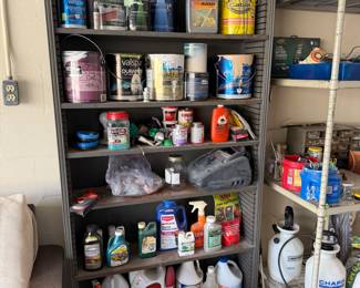 Paints and chemicals on vintage metal shelf 