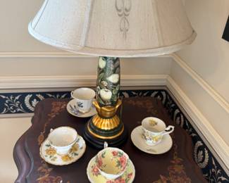 Cups and saucers, oak and mahogany decoupage table, Asian lamp