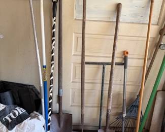Shovels rakes brooms