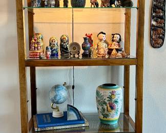 Hollywood Regency Rattan and Glass Display Shelf with Light. Russian Nesting Dolls, Vintage Chinese Terra-cotta Army, Globe and more...