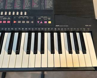 F53 - $35. Yamaha Keyboard on Stand. PSR-215 with foot pedal. 