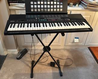 F53 - $35. Yamaha Keyboard on Stand. PSR-215 with foot pedal. 
