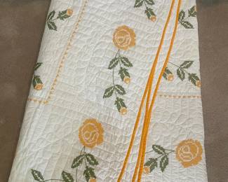 F75 - $50 Quilt. Measures 85" x 78". Has minor light staining. Looks to be hand stitched & cross stitched. 