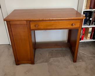 F88 - $50. Vintage Solid Wood Desk. Measures 39" wide x 21" deep x 29" tall. Has bookcase on the side