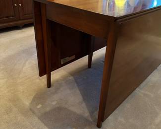 F7 - $750. Henkel-Harris Co.  Solid Wild Black Cherry. Drop Leaf Table. Style # 2123. Includes 4 chairs. Measures 44" wide x 6' long. 29" tall. 24" with the leaves down. Very good vintage condition - was always used with the table pads on it. 