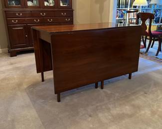 F7 - $750. Henkel-Harris Co.  Solid Wild Black Cherry. Drop Leaf Table. Style # 2123. Includes 4 chairs. Measures 44" wide x 6' long. 29" tall. 24" with the leaves down. Very good vintage condition - was always used with the table pads on it. 