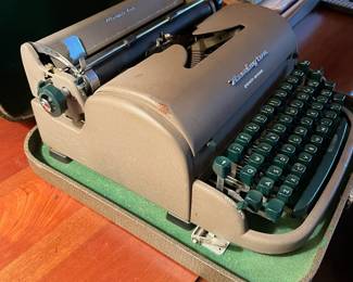 F6 - $65. Remington Quiet-Riter in case. 
