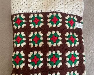 F77 - $25. Vintage Crochet Blanket. Measures 73" x 55". Very good condition. Brown, Green, Cream & Red. 