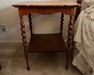 F68 - $50. Wooden Side Table with Barley Twist Legs. Measures 24.25" square x 29.5" tall. Top is veneer. Overall good condition - a little wiggly. 