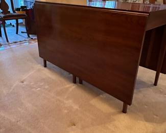 F7 - $750. Henkel-Harris Co.  Solid Wild Black Cherry. Drop Leaf Table. Style # 2123. Includes 4 chairs. Measures 44" wide x 6' long. 29" tall. 24" with the leaves down. Very good vintage condition - was always used with the table pads on it. 