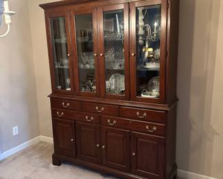 F8 - $950. Henkel-Harris China Cabinet. Moves in 2 pieces. Measures 5' wide x 17" deep x 79" tall. Base is 37". Top is 42". 